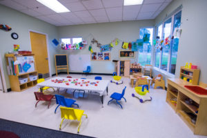 Image of a children's counseling office with a table and chairs.