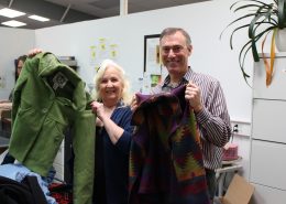 Dianne Denham and Jeff Cogen display donated coats