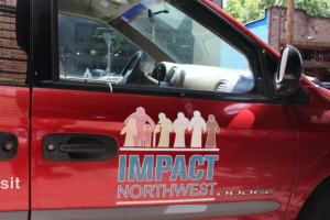 Van with Impact NW logo