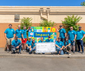 Rick's Fencing Team Holding Large Check