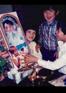 Hanh Vu and her siblings opening gifts received through Impact NW’s holiday assistance program
